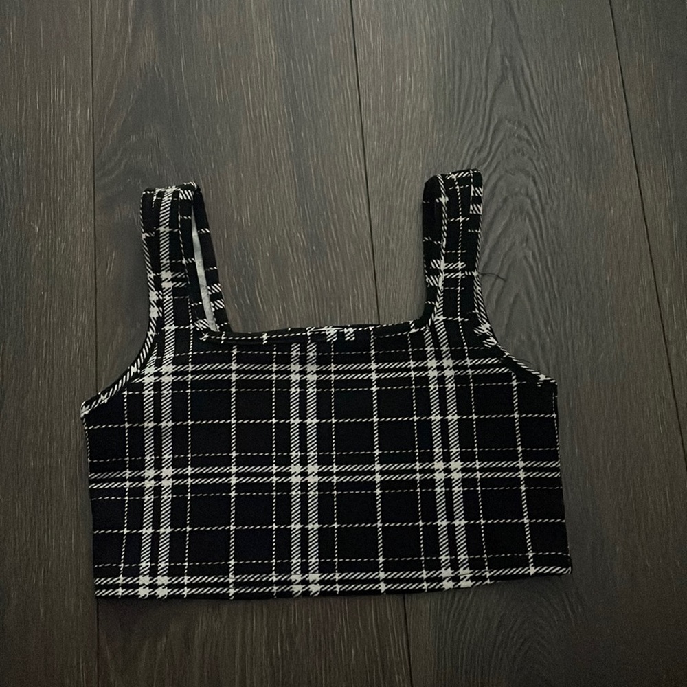 Shein top. It’s a kid size 10y but it would fit someone who is like xxs adult.
